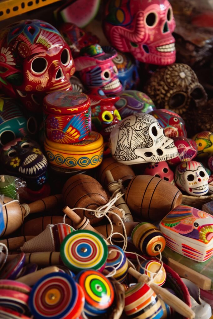 Vibrant Mexican skulls and traditional toys on display, perfect for cultural themes.
